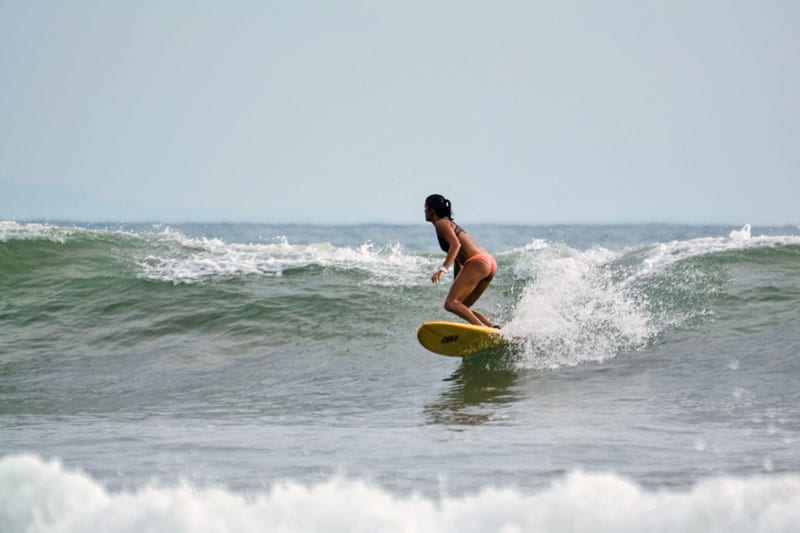 Adrianne surfing Bahia Ballena