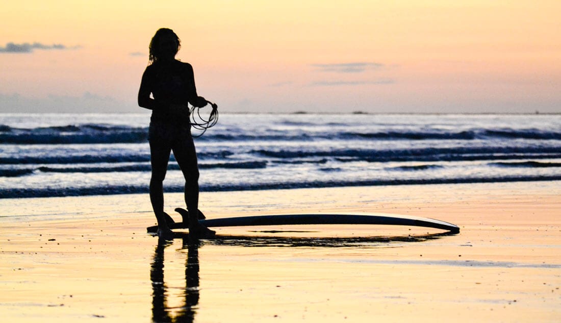 Surfer girl in Bahia Ballena