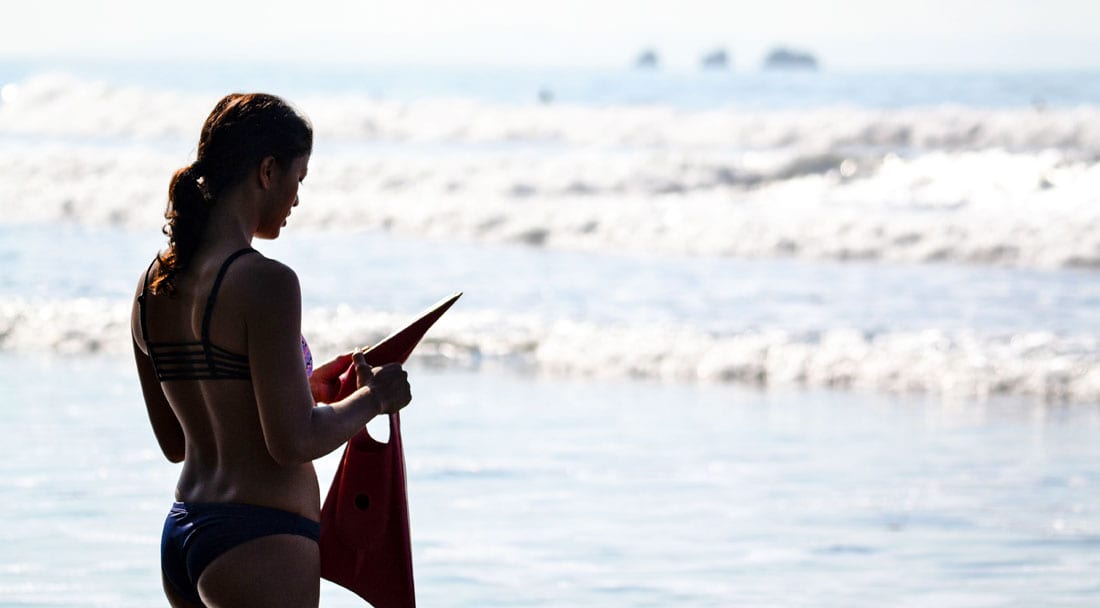 Surfer girl learning to bodysurf