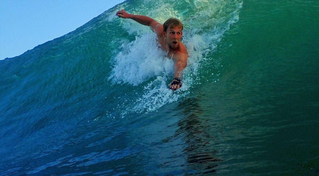 Bodysurfing a green wave
