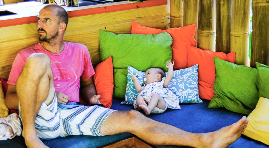 Bodhi Surf + Yoga co-founder Travis Bays with second daughter Clea