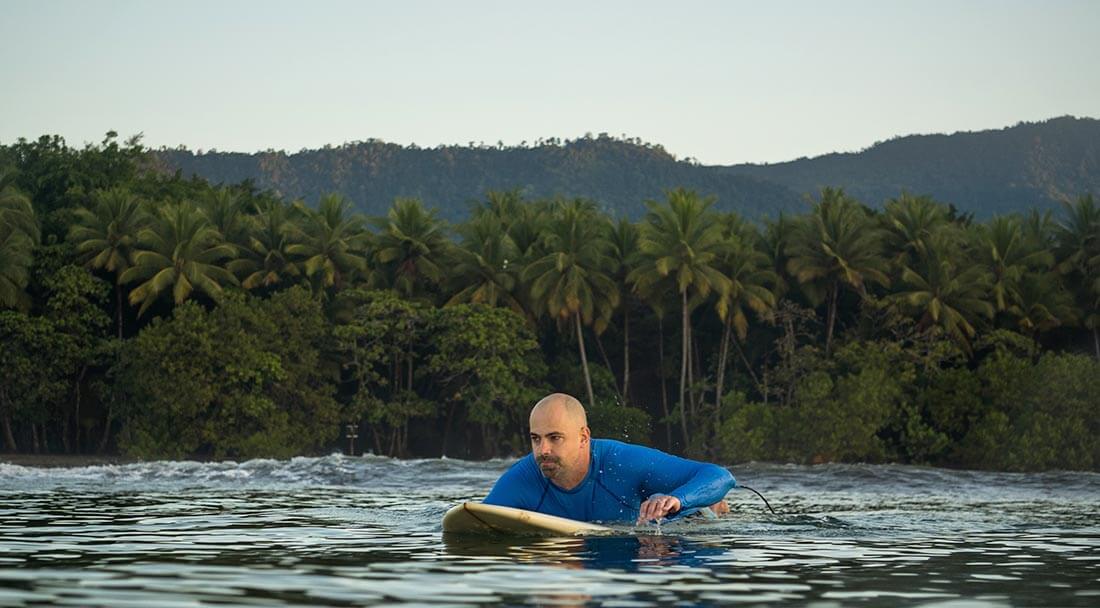 Paddling out in the correct position to surf in Costa Rica