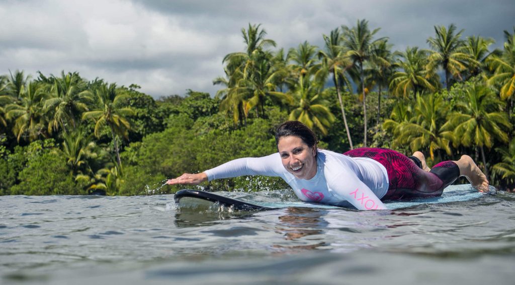 Paddling out to surf in Uvita