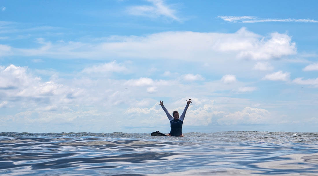 Surfer stoked being in the ocean